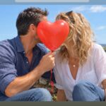 Couple sharing a romantic moment, illustrating why we fall in love with one particular person and the psychology of emotional attraction.